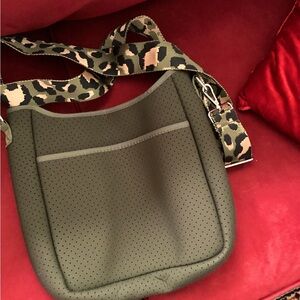 Stylish Olive Green Perforated Bag with Leopard Strap